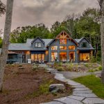 Lakeside Cottage Family Cottage Luxury Retreat Great Room Build Cottage Portfolio Project Normerica Timber Frame Homes Exterior Stone Walkway